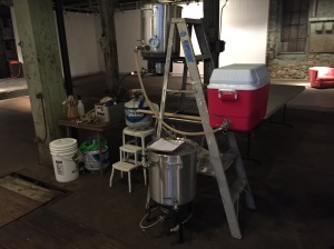 Our temporary setup. Water boiler on the top, mash tun ((AKA a tricked up cooler), and the brew kettle on the floor.